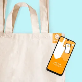 A photo of a goodbag sustainable tote bag being scanned with an NFC phone