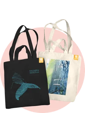 Two different tote bags with ocean-themed designs