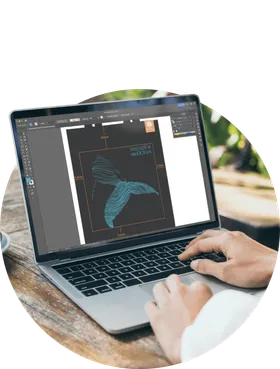 A macbook with a design file for a custom bag design