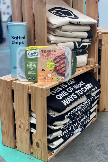 Shelves with stucked event goodie bags and a garden gourmet vegan plant-based burger