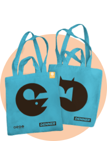 Two turquoise tote bags with custom prints by denner