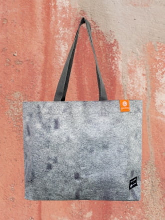 A grey goodbag made from the audi megaposter